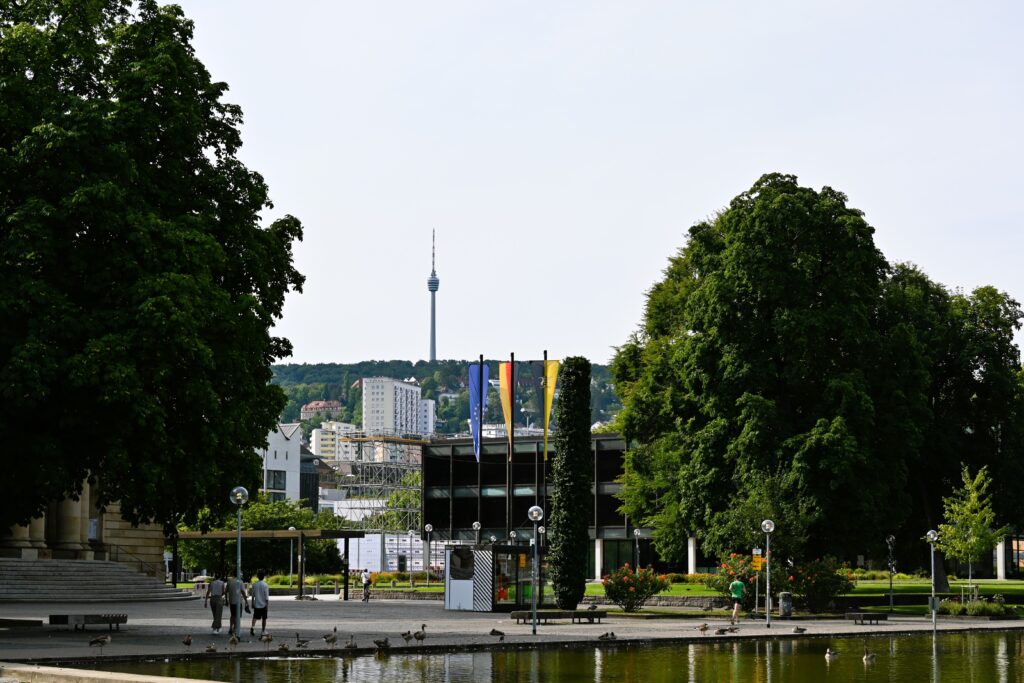 A scenic view of Stuttgart park showcasing greenery and iconic TV tower in the distance.